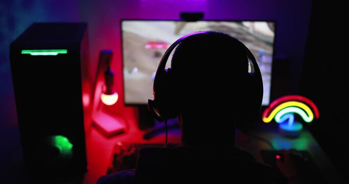 Streamer gamer playing at strategy game in broadcast browser - Young man having fun gaming and streaming online - New technology game trends and computer entertainment concept