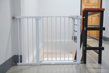 Baby gate safety door, white fence for safety children on stairs or dog gate.