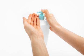 Disinfection of hands. hands applying antiseptic spray to prevent coronavirus or flu, on a white background,