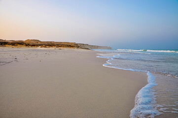 Water waves on the rocky Duqm beach 