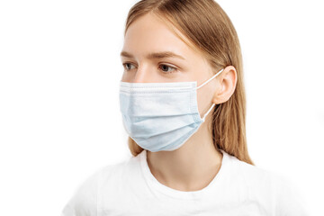 Close-up of a young woman, in a surgical mask on her face, to prevent infection, on an white background, Protection against infectious diseases, coronavirus