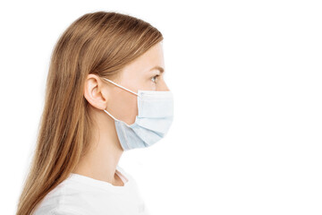 young woman in mask looking at camera, on isolated white background. Flu epidemic, coronavirus, virus protection