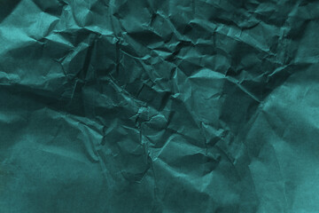 Crumpled dark green color craft organic paper texture background.Tidewater Green colour trends 2021