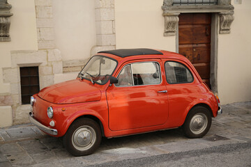 Fototapeta na wymiar Antique car from the 1960s on the streets of Gubbio, Italy