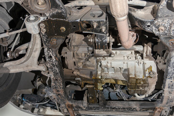 Engine under the car, close-up, bottom view.