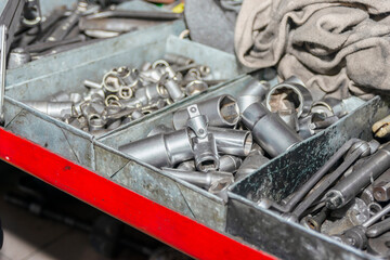 An iron box contains a set of heads and keys.