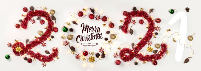 New Year 2021. Christmas. Holidays. Composition with Christmas and New Year garlands, numbers 2021