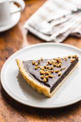 Sweet chocolate pie with crushed nuts.
