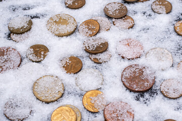 Close-up of various coins covered with white salt for ritual for wealth. The concept of mysticism, fortune-telling