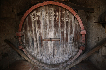 the monumental Barrel of the Canons in the city of Gubbio. The capacity, equivalent to 20124 liters, is written on the front of the barrel in the ancient local language
