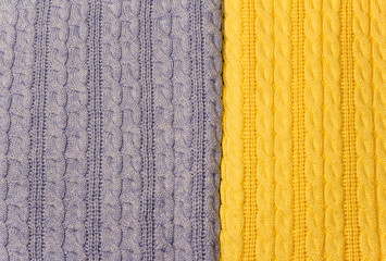 Knitted blue and yellow background with a pigtail pattern.