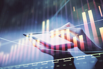 Double exposure of forex chart sketch hologram and woman holding and using a mobile device. Financial market concept.