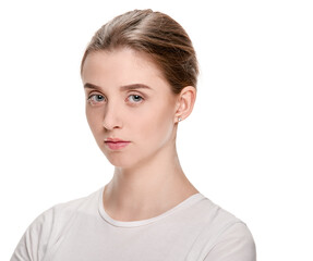 Fototapeta premium Portrait of young serious girl with perfect smooth skin on white background