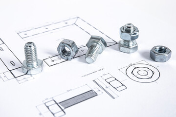 Technical drawing with bolts and nuts. Close-up picture taken in studio with soft-box.