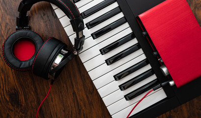 Piano, headphones and sound card. Home music studio concept.