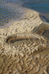 Patterns in sand created by waves