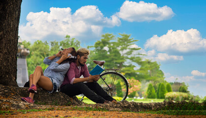 Happiness and romantic scene of love asian couples partners making eye contact in the garden. Lifestyle Concept