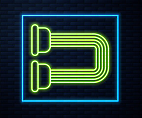 Glowing neon line Chest expander icon isolated on brick wall background. Vector.