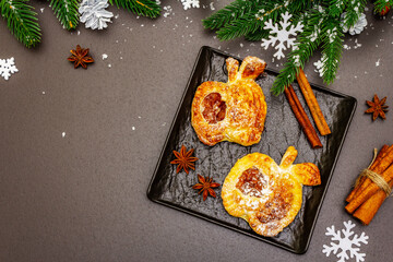 Christmas or New Year sweet apple puffs with festive decor