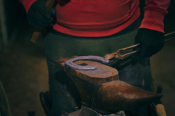 Blacksmith make a horseshoe