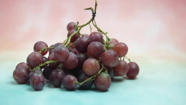 A red seedless grapes chilled on wood table.