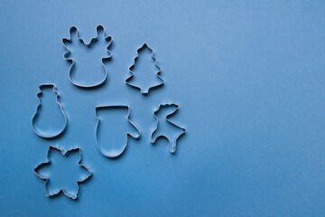 cookie cutters on blue background. top view with copy space . isolated. mock up