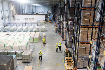 Workers during work in warehouse, view from above