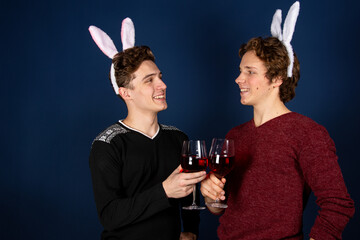 Two young attractive guys. Easter and bunny costume.
