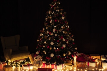 Fototapeta na wymiar Christmas tree lights garland decor New Year's Night feast