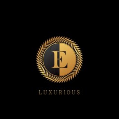 Golden E letter Logo Luxurious Nature Leaves, elegance vector design concept circle floral leaves with negative space letter logo.