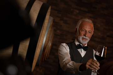 Man choosing and tasting wine