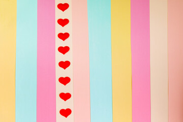 Fototapeta premium Multicolored background with a red heart.