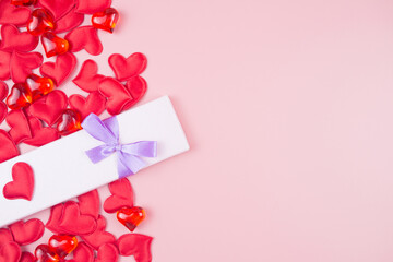 Valentine's Day Background with gift box and hearts. Place for text.