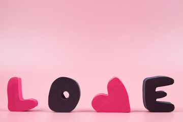 Word Love, on a pink background. Valentines day background