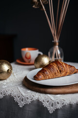 croissants on the new year's table, on a white tablecloth, vegan croissants, Breakfast at home, new year, Christmas