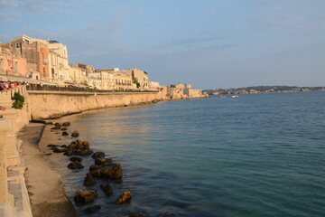 Fototapeta na wymiar Syracuse is a greek city in Sicily where Archimedes was born. It is known for the ruins of antiquity. Here the peninsula of Ortigia which is the ancient center and the Maniace castle. 