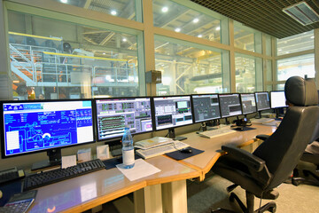control center with screens in a paper mill - modern technology control