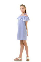 Portrait of Teen Girl in Light Blue Dress Standing Half Turn