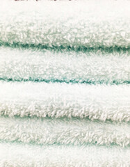 Stack of different green towel