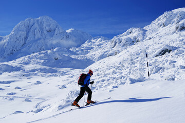 Fototapeta na wymiar Ski in The Carpathians during a sunny day, Romania, Europe