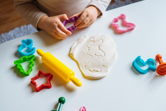 Close View Of Child's Hands Playing With Homemade Playdough. Children's Creative Game For Early Development And Fine Motor Skills.