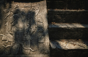 Sunlit Basrelief carving of Mayan king at the archaeological site of Palenque, Chiapas, Mexico