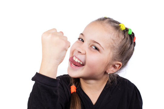 Funny girl with fist. Girl shows tounge and fist.