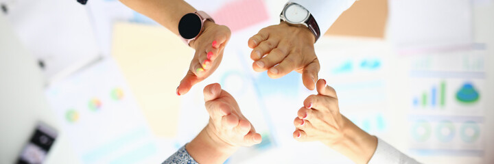 Business people over the work table are greeting hands. Successful business ideas and agreements...