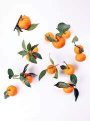 mandarin orange green leaf float fall drop on white background