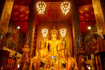 Fototapeta premium Beautiful Big Golden Buddha is enshrined in the church of Phra That Hariphunchai,Lamphun,Thailand,ASIA.