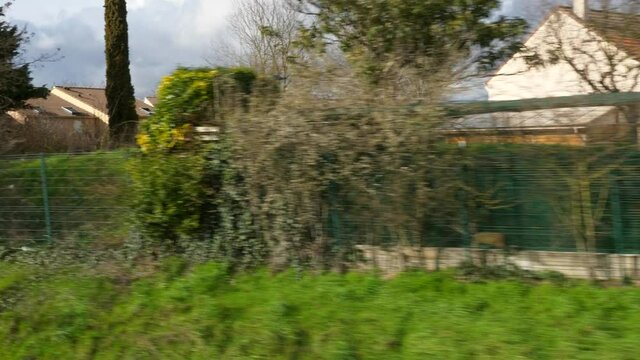 Suburban Neighborhood Town Row Houses. POV View out  of RER Train Window. Paris Suburbs near Railway. Ile-de-France Europe. 2020. 2x Slow motion 60 fps 4K