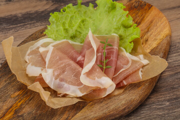 Italian prosciutto pork meat over board