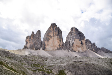 The National Park Tre Cime di Lavaredo. The three  peaks. Blue sky, clouds, mountains, landscape, dolomites, alps.