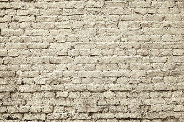 solid part of the old brick wall for a vintage textured background of pale color